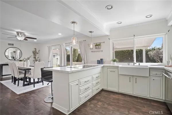 a kitchen with sink cabinets and window