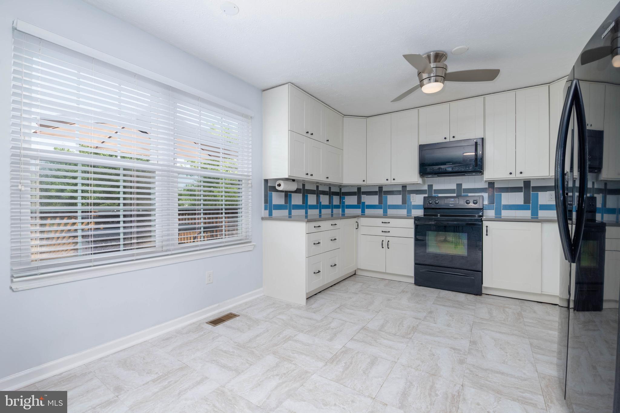 540 Doefield Court Abingdon, MD 21009 - Photo 11 of 48 a kitchen with stainless steel appliances a stove sink and microwave