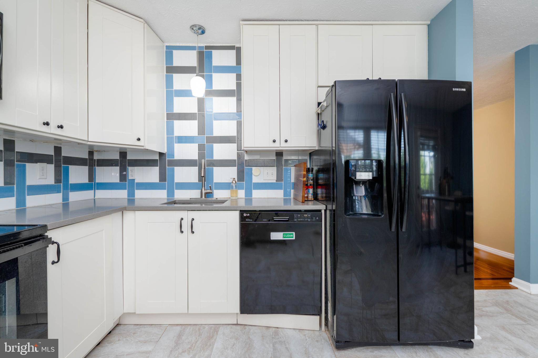 540 Doefield Court Abingdon, MD 21009 - Photo 12 of 48 a kitchen with stainless steel appliances a refrigerator and cabinets