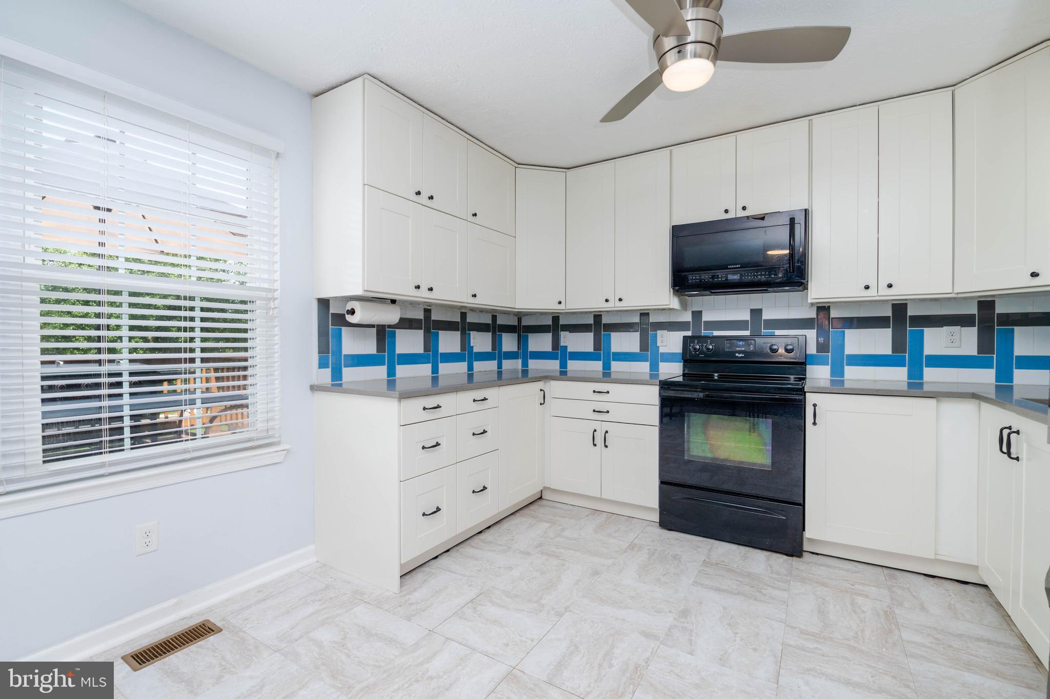 540 Doefield Court Abingdon, MD 21009 - Photo 13 of 48 a kitchen with white cabinets and appliances
