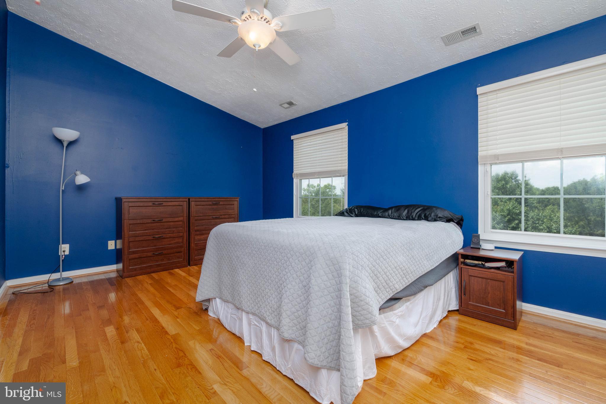 540 Doefield Court Abingdon, MD 21009 - Photo 17 of 48 a bedroom with a bed and a chandelier