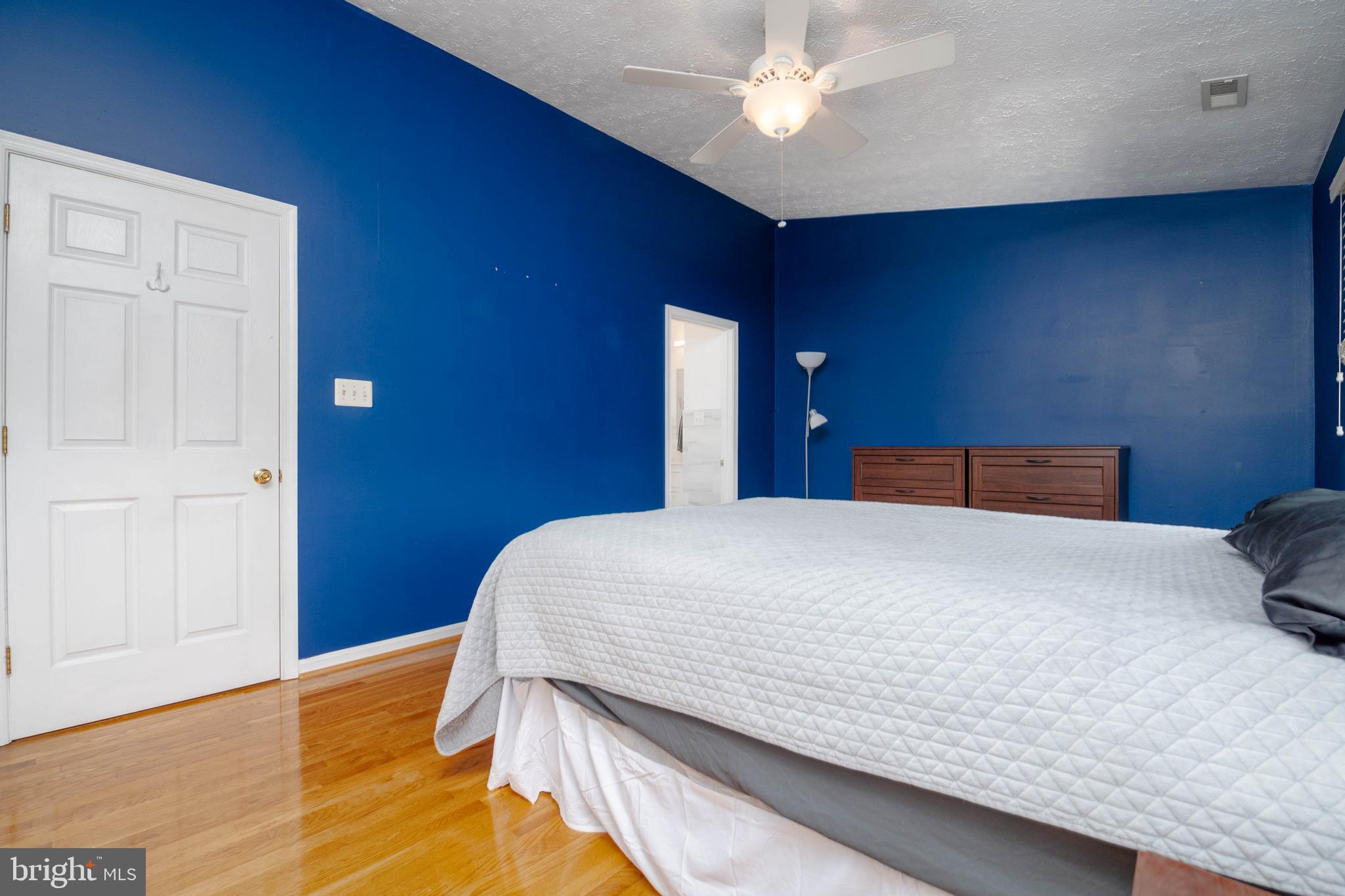 540 Doefield Court Abingdon, MD 21009 - Photo 19 of 48 a bedroom with a bed and a ceiling fan