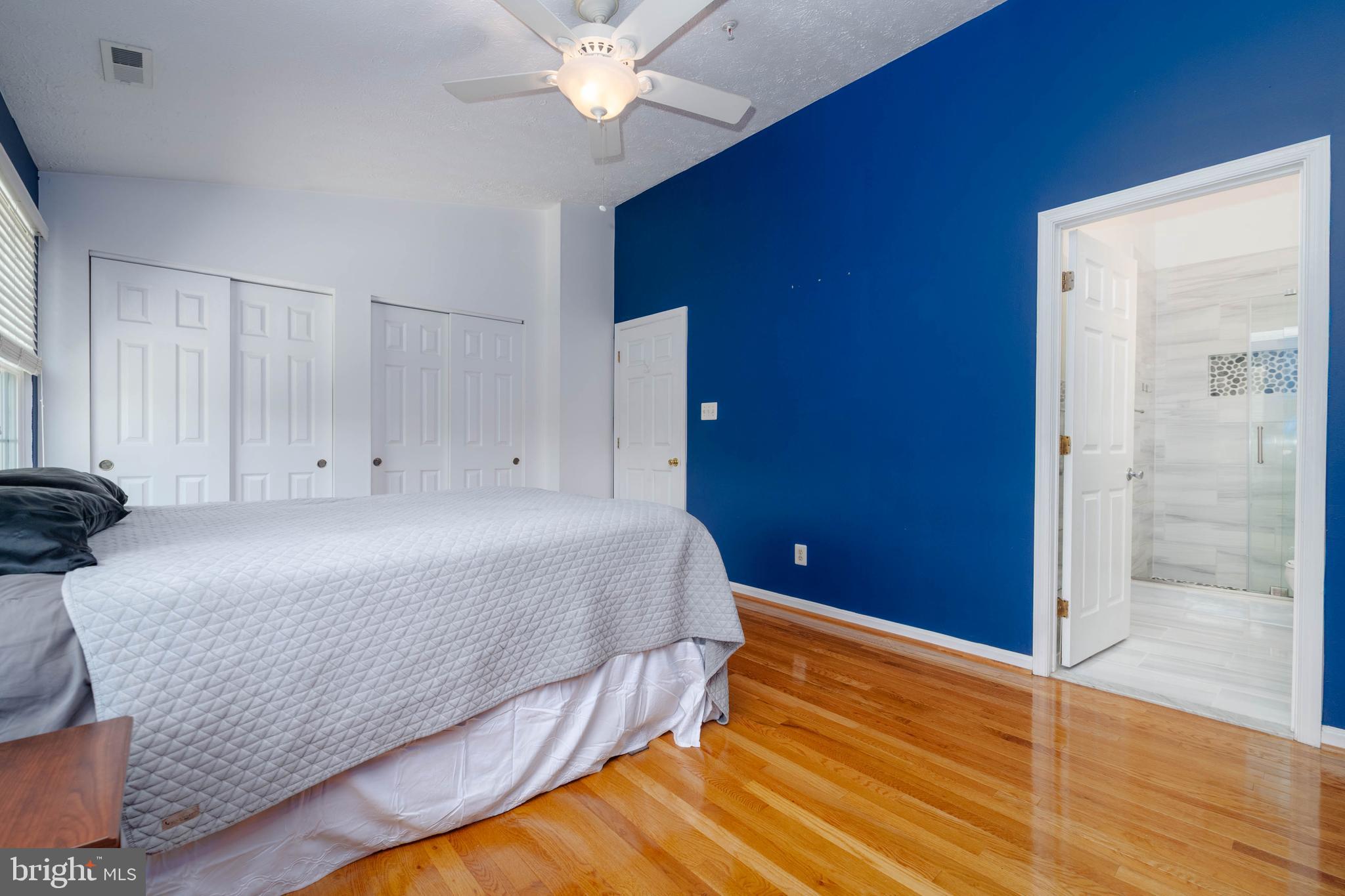 540 Doefield Court Abingdon, MD 21009 - Photo 20 of 48 a bedroom with a bed and a chandelier