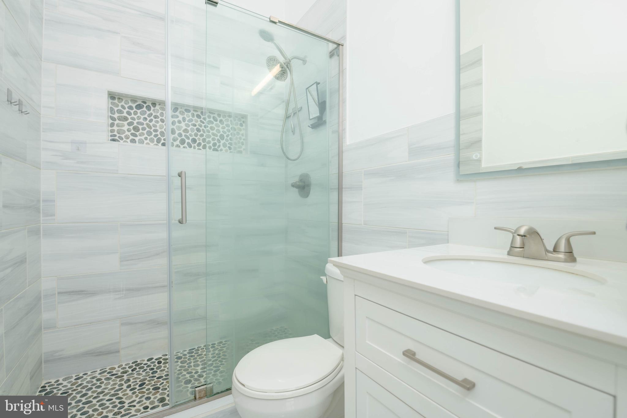 540 Doefield Court Abingdon, MD 21009 - Photo 21 of 48 a bathroom with a sink a toilet and shower