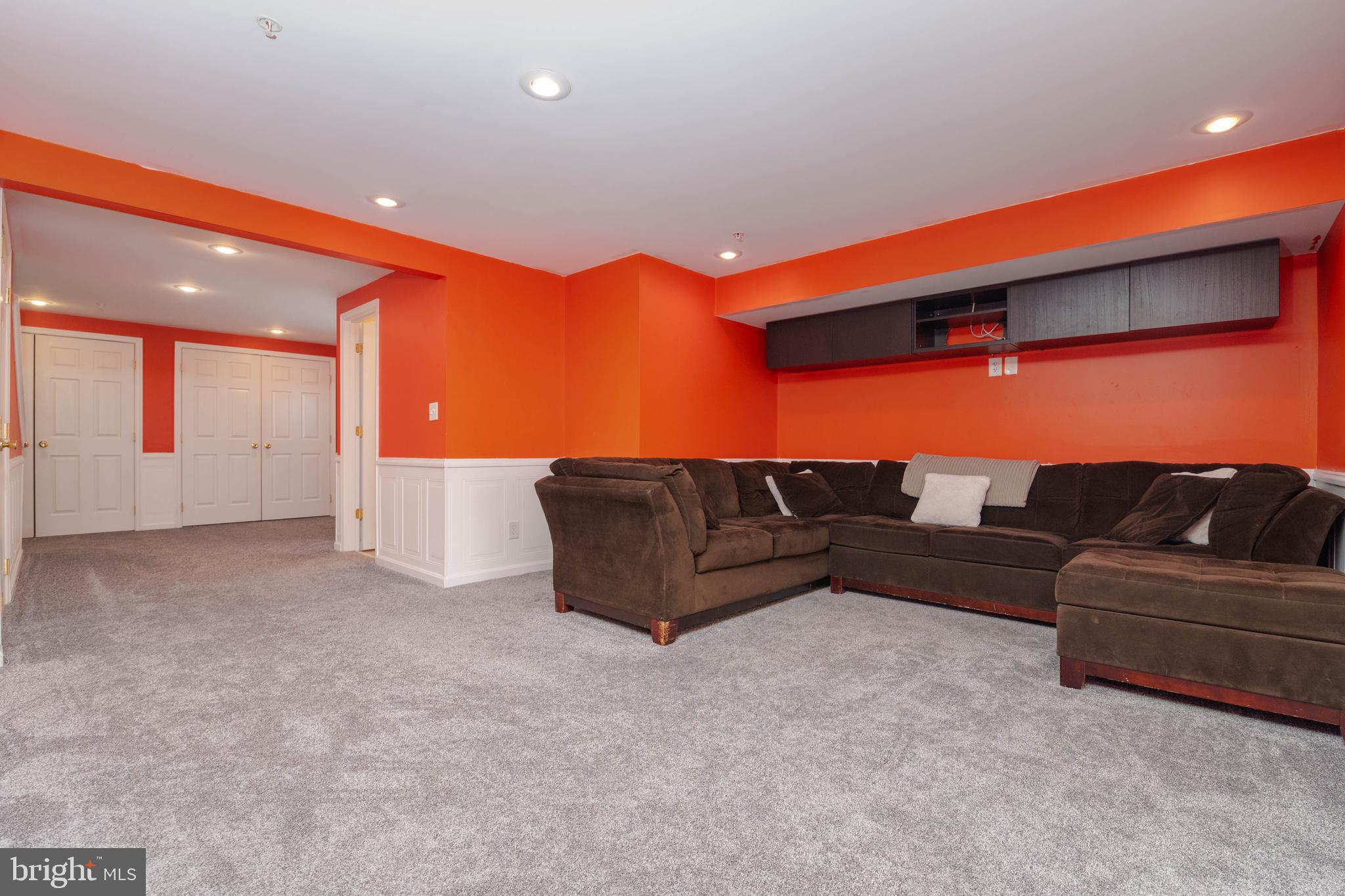 540 Doefield Court Abingdon, MD 21009 - Photo 31 of 48 a living room with a couch and a potted plant