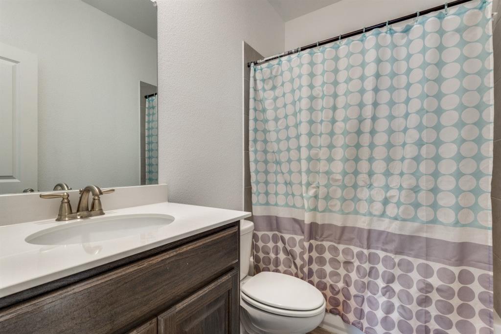 10312 Georgetown Place McKinney, TX 75071 - Photo 15 of 25 a bathroom with a sink a toilet and shower