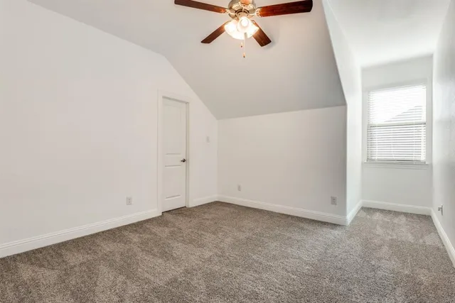 a room with gym equipment and a window