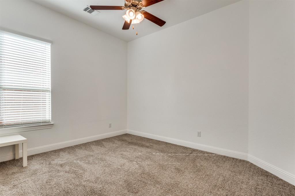 10312 Georgetown Place McKinney, TX 75071 - Photo 18 of 25 an empty room with a window and a fan