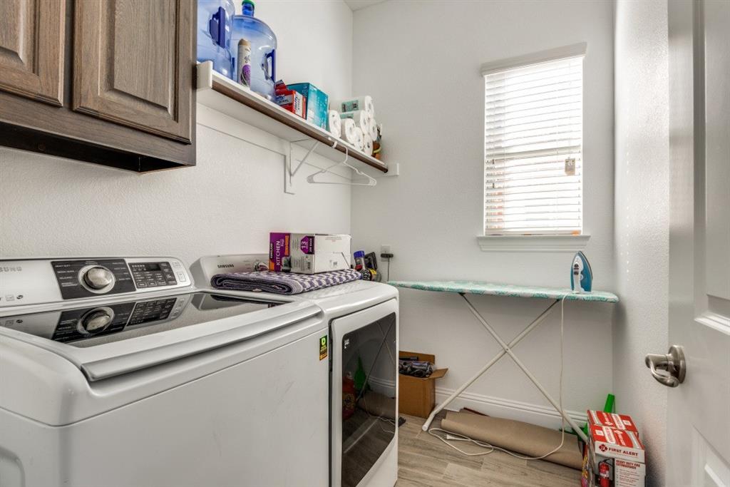 10312 Georgetown Place McKinney, TX 75071 - Photo 22 of 25 a kitchen with stainless steel appliances granite countertop a sink and cabinets