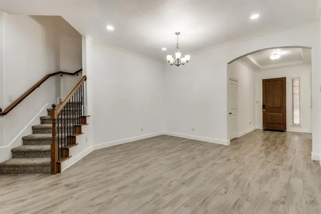 a view of a living room and a livingroom with furniture wooden floor