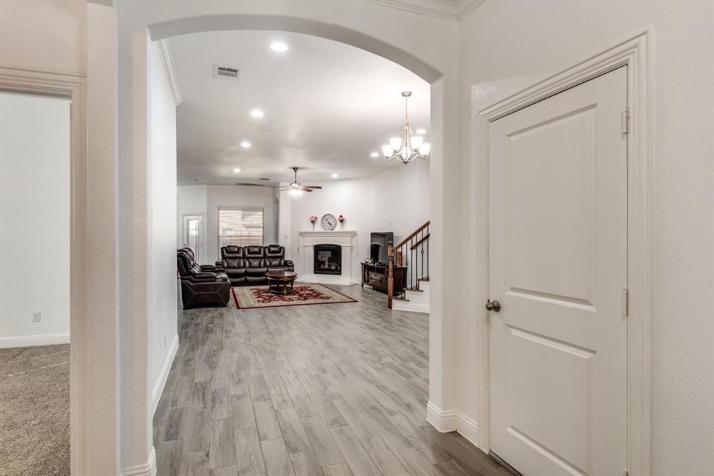 10312 Georgetown Place McKinney, TX 75071 - Photo 4 of 25 a view of a living room and a livingroom with furniture wooden floor