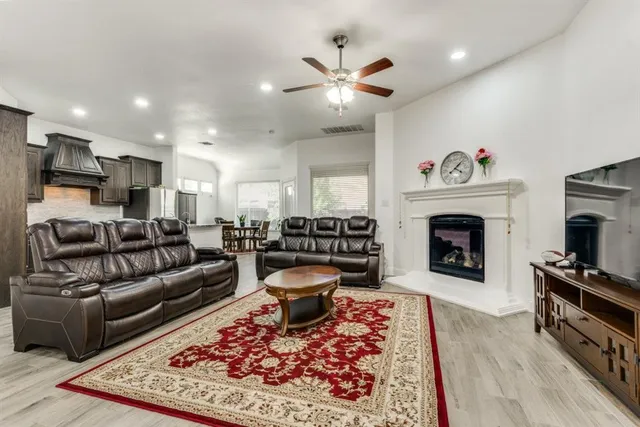 a kitchen with stainless steel appliances granite countertop a stove and a refrigerator