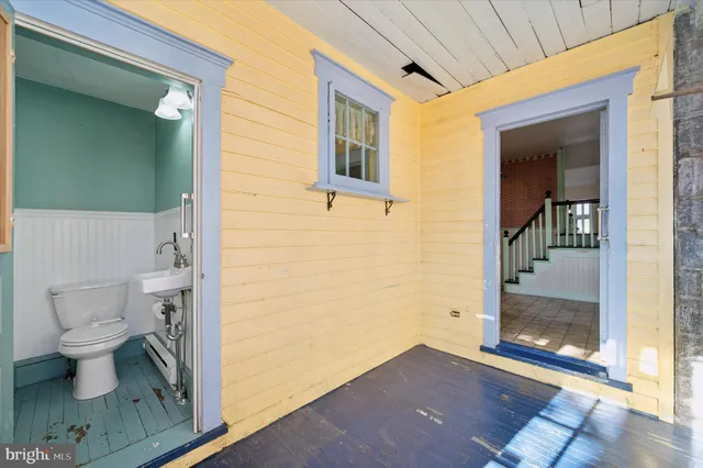 a view of a bathroom with a toilet