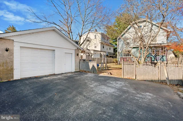 a view of garage yard and tree