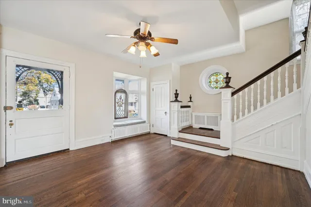 a view of an entryway with wooden floor