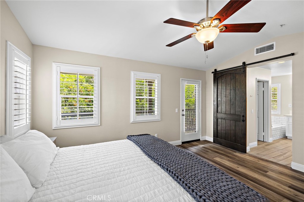 71 Sklar Street Ladera Ranch, CA 92694 - Photo 21 of 55 a bedroom with a large bed and a window