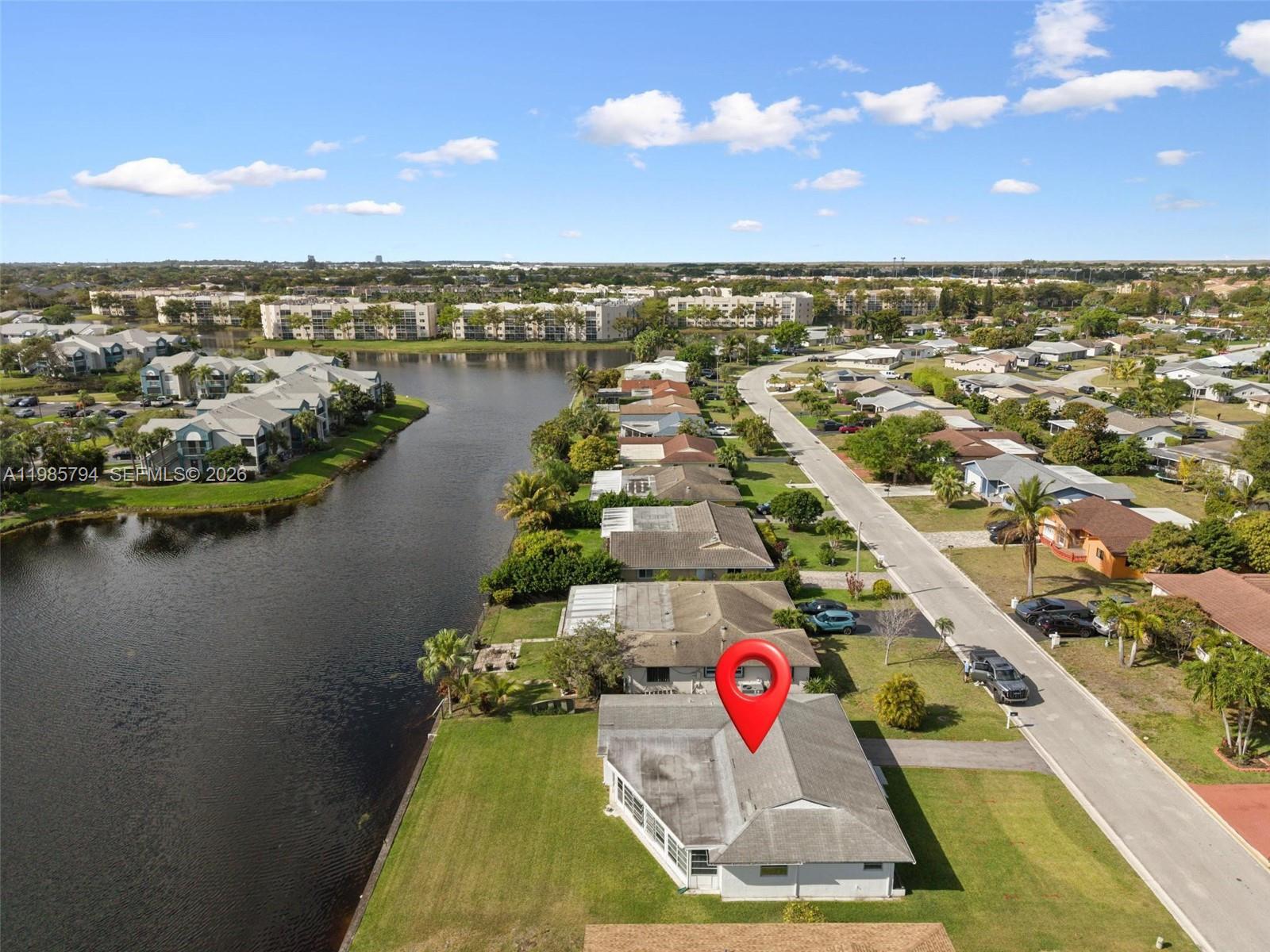 9306 Northwest 80th Street Tamarac, FL 33321 - Photo 1 of 45 an aerial view of residential houses with outdoor space and lake view