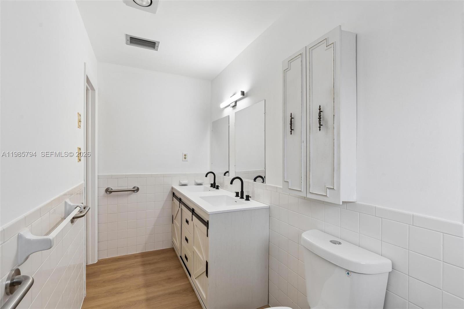 9306 Northwest 80th Street Tamarac, FL 33321 - Photo 15 of 45 a bathroom with a sink toilet and shower