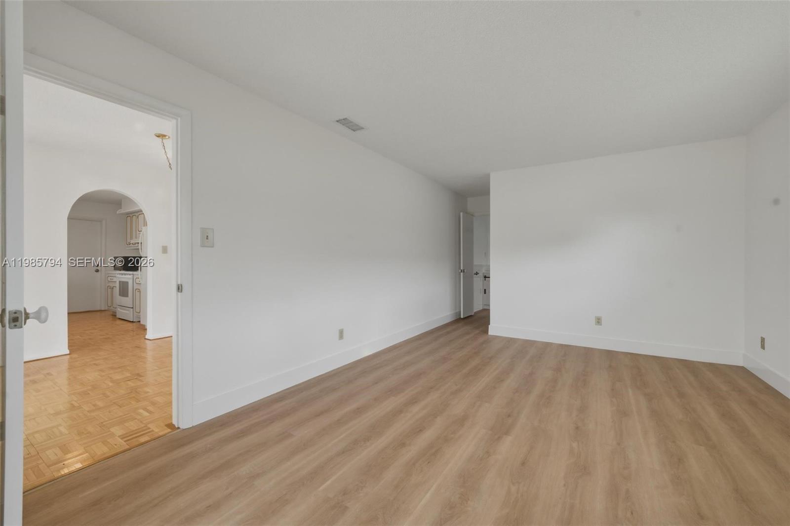 9306 Northwest 80th Street Tamarac, FL 33321 - Photo 19 of 45 a view of empty room with wooden floor