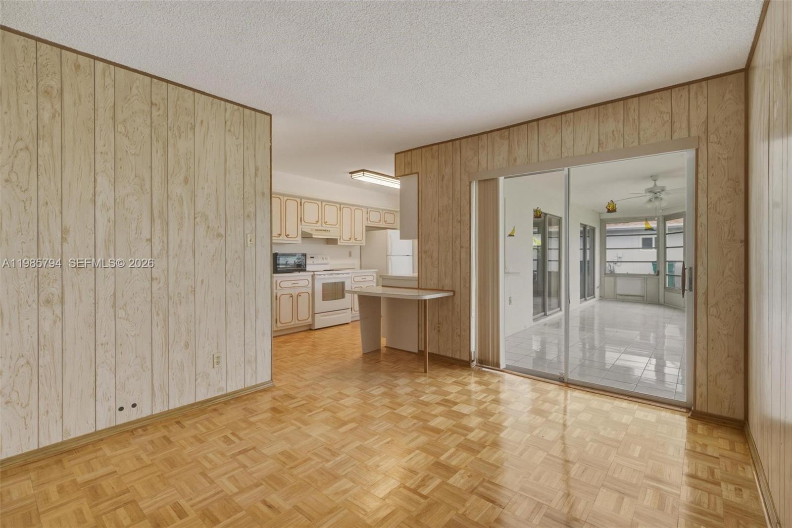 9306 Northwest 80th Street Tamarac, FL 33321 - Photo 25 of 45 a view of a kitchen with a sink and a refrigerator
