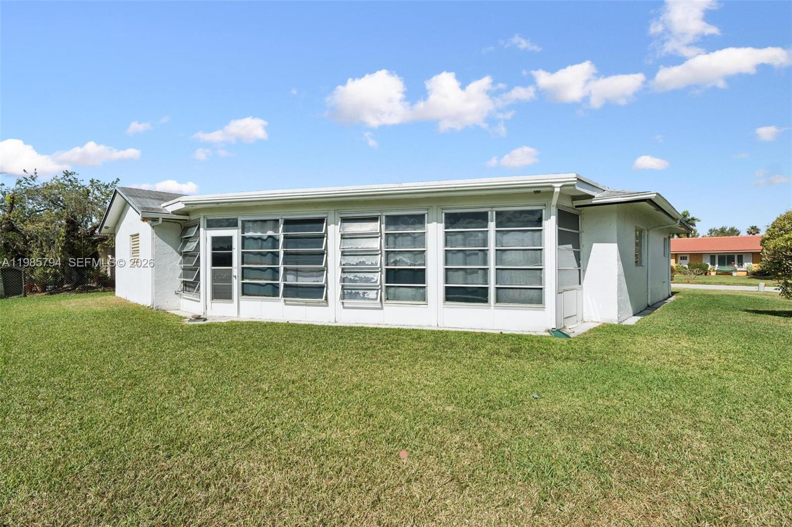 9306 Northwest 80th Street Tamarac, FL 33321 - Photo 42 of 45 a view of a house with backyard