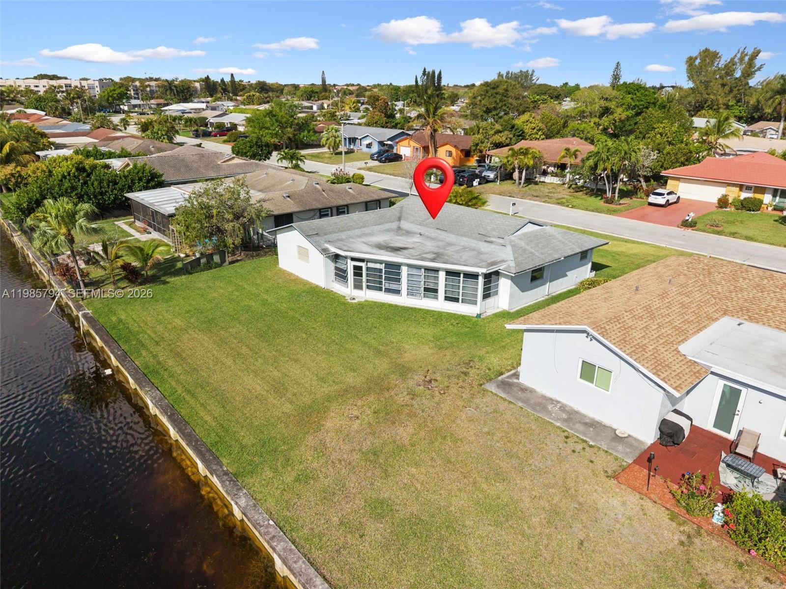 9306 Northwest 80th Street Tamarac, FL 33321 - Photo 44 of 45 an aerial view of residential houses with outdoor space and swimming pool
