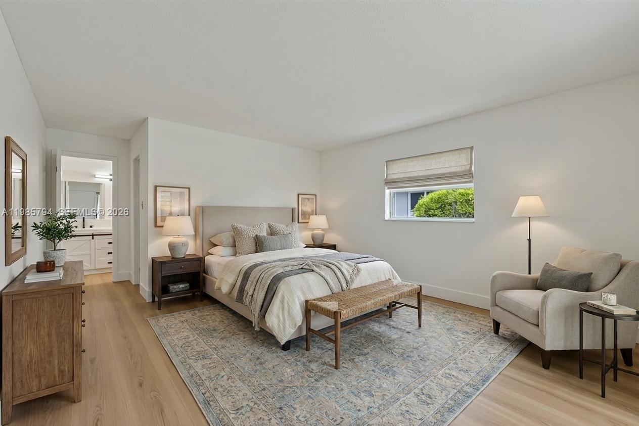 9306 Northwest 80th Street Tamarac, FL 33321 - Photo 5 of 45 a bed room with a bed and a couch