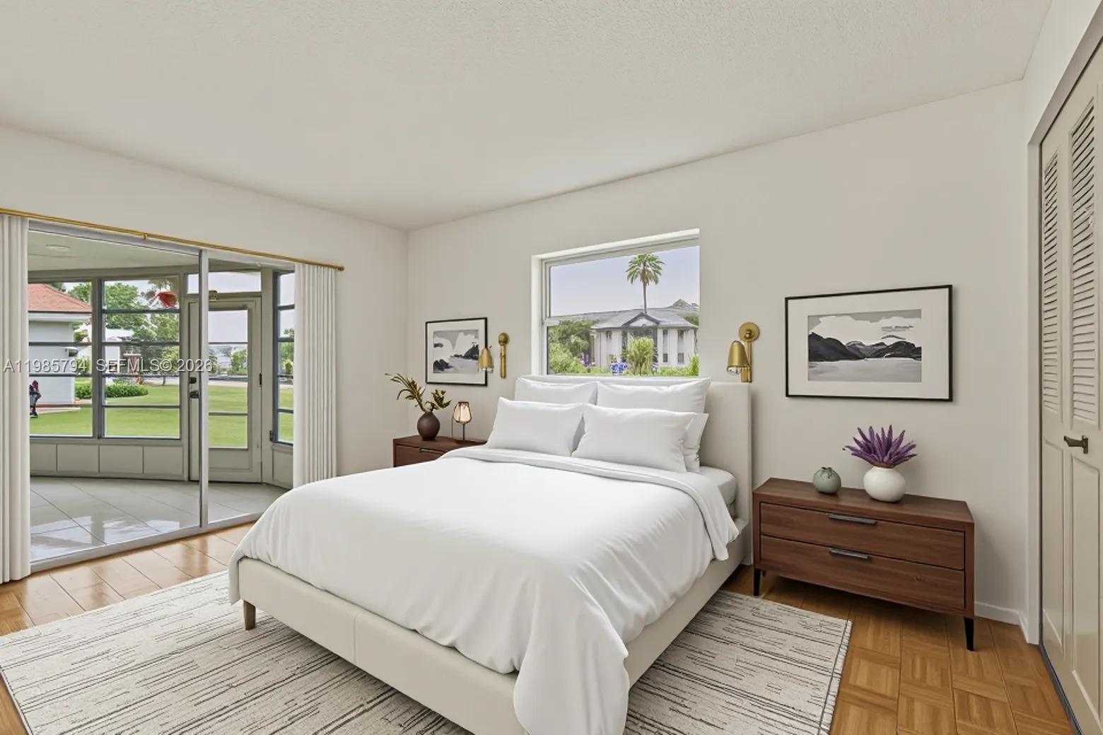 9306 Northwest 80th Street Tamarac, FL 33321 - Photo 6 of 45 a bedroom with a bed and wooden floor
