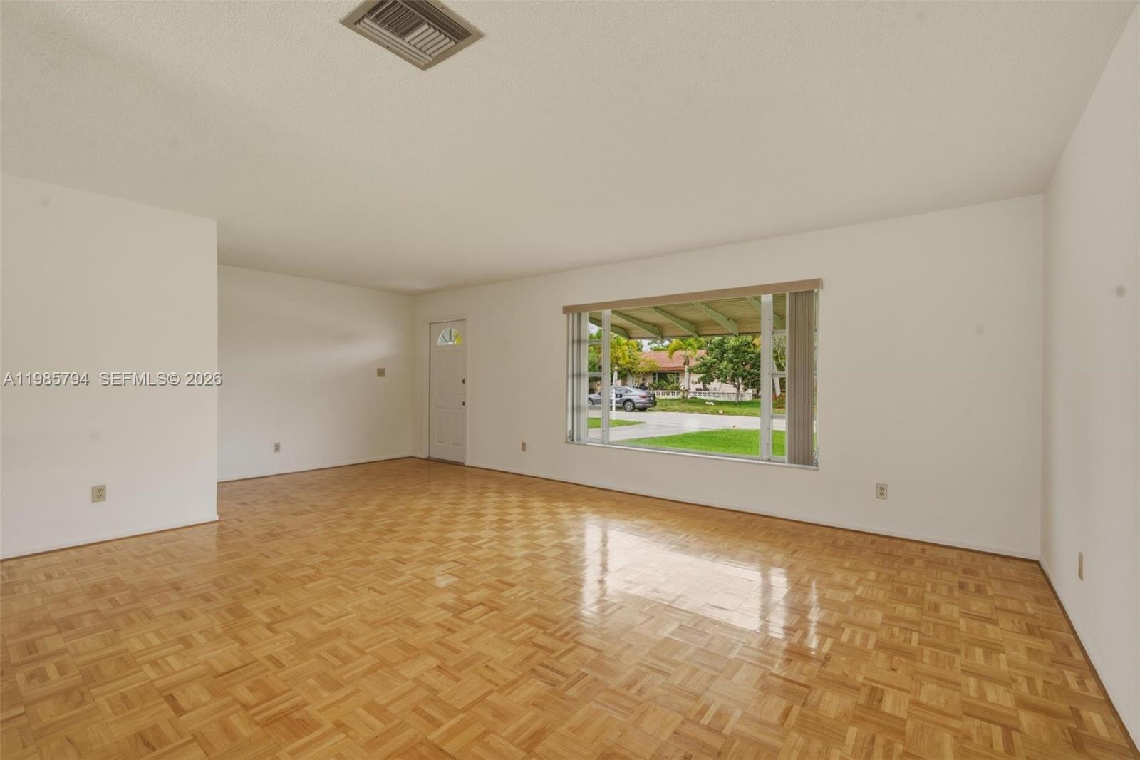 9306 Northwest 80th Street Tamarac, FL 33321 - Photo 8 of 45 an empty room with windows
