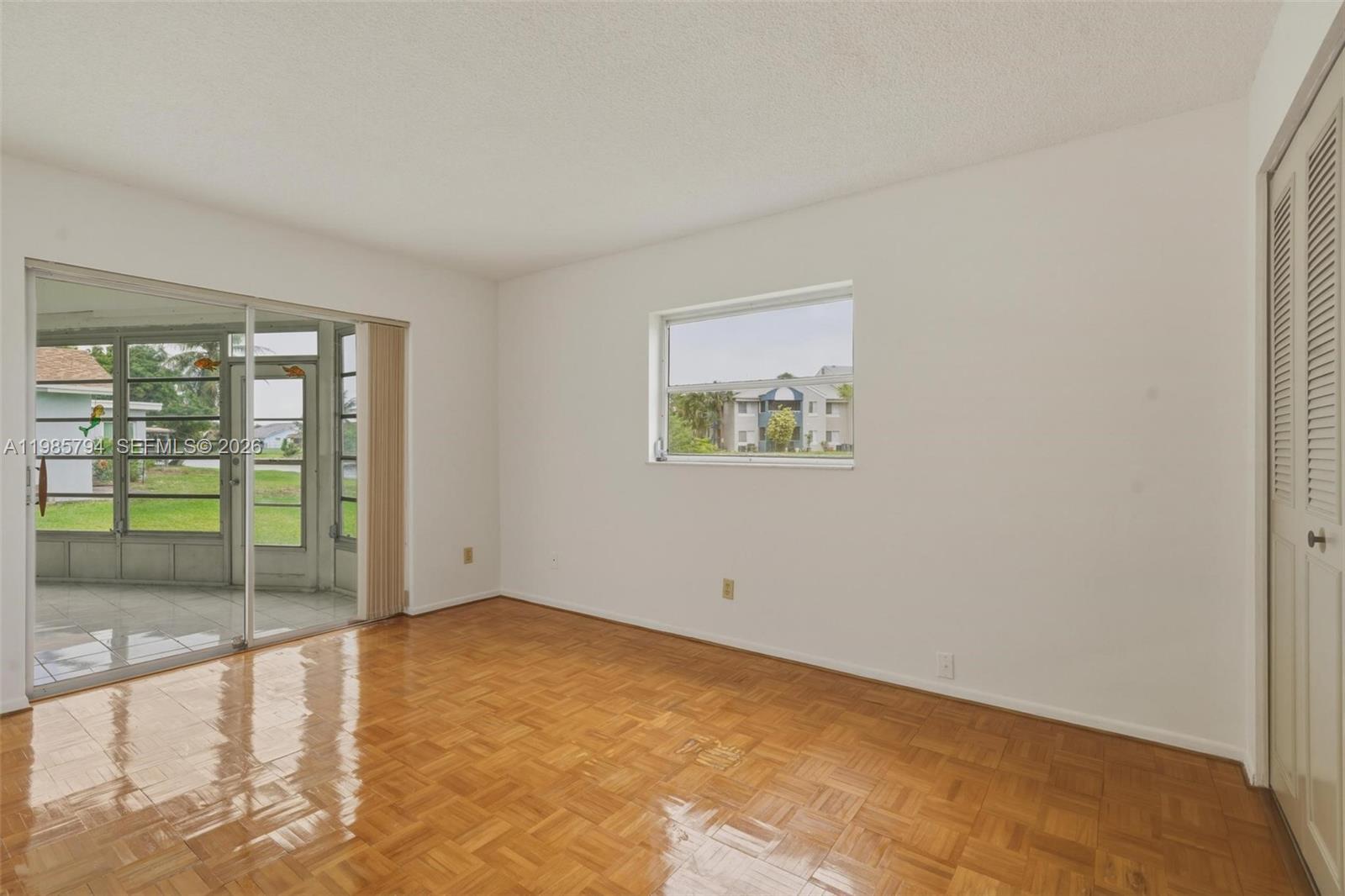 9306 Northwest 80th Street Tamarac, FL 33321 - Photo 9 of 45 a view of an empty room with glass door