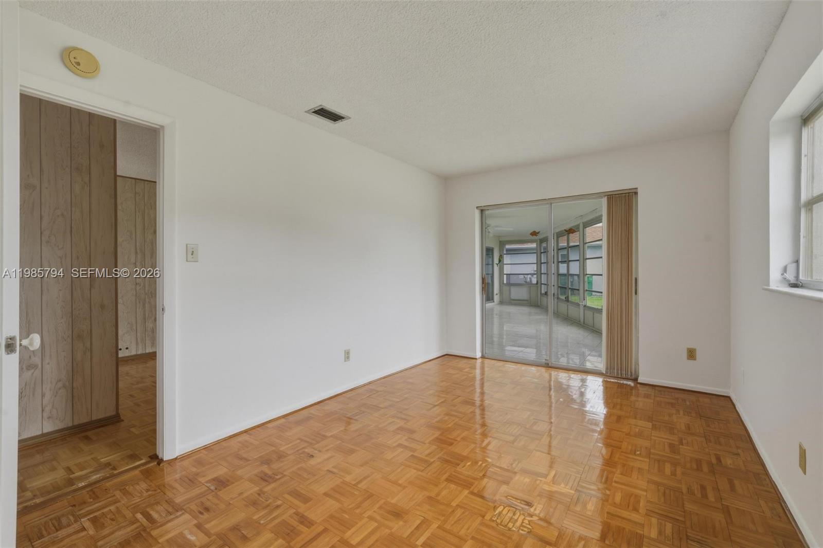 9306 Northwest 80th Street Tamarac, FL 33321 - Photo 10 of 45 an empty room with windows