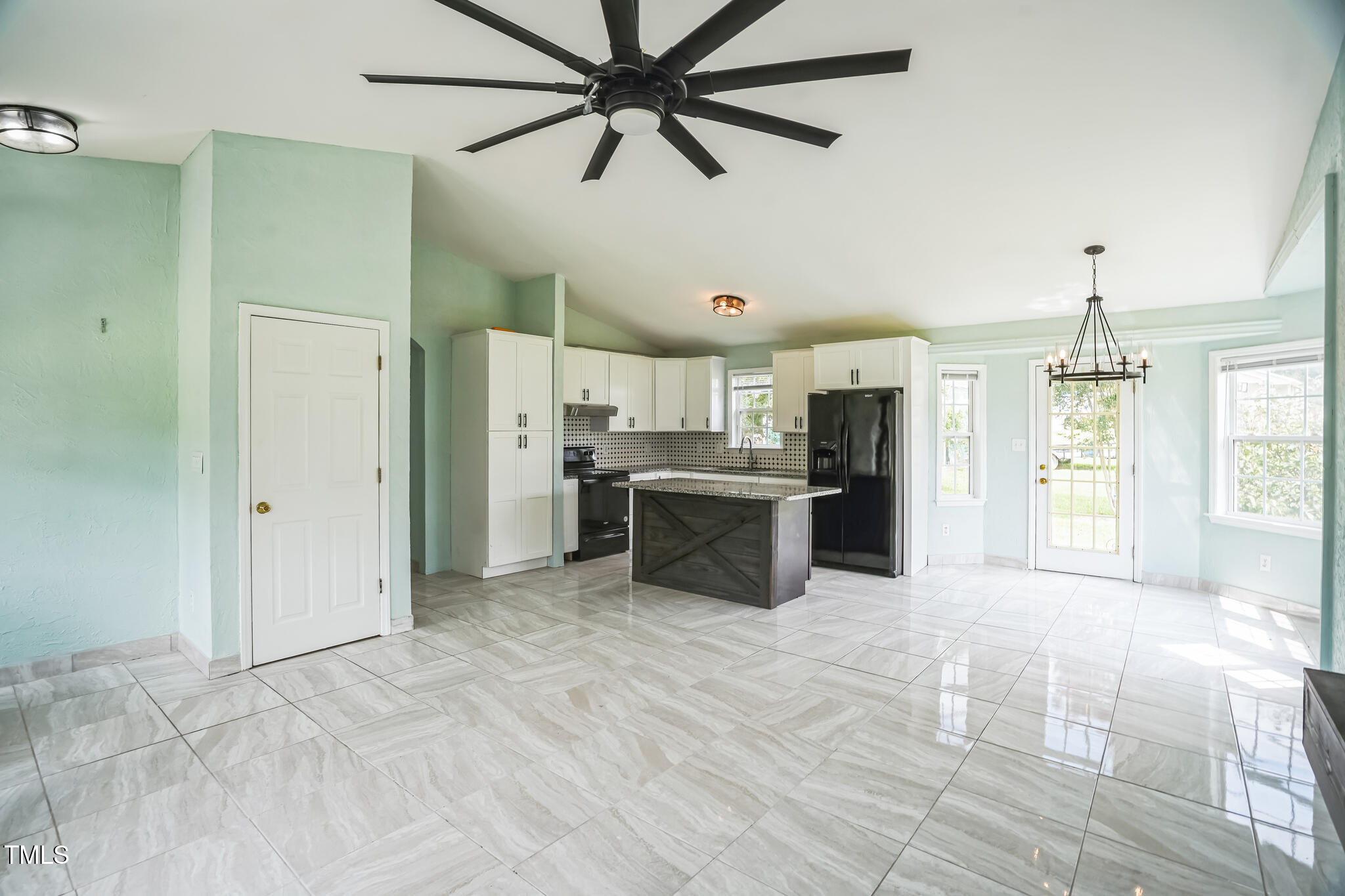1270 Old School Road Four Oaks, NC 27524 - Photo 10 of 30 a kitchen with stainless steel appliances kitchen island a refrigerator sink and cabinets