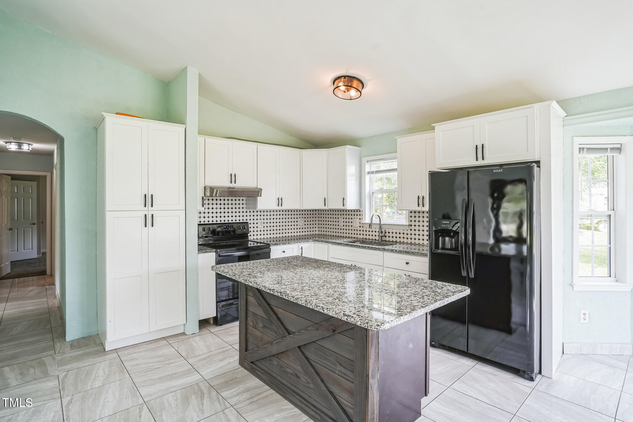1270 Old School Road Four Oaks, NC 27524 - Photo 12 of 30 a kitchen with a stove a refrigerator and a sink