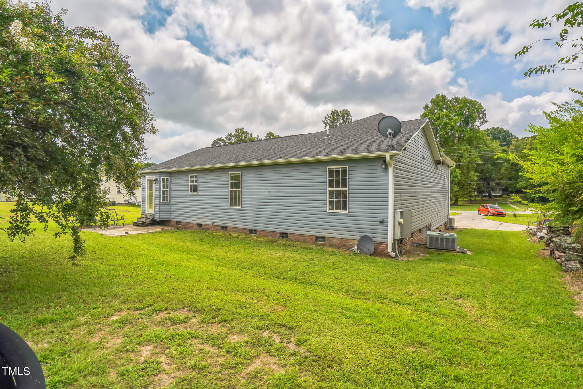 1270 Old School Road Four Oaks, NC 27524 - Photo 3 of 30 a view of a backyard with plants and a garden