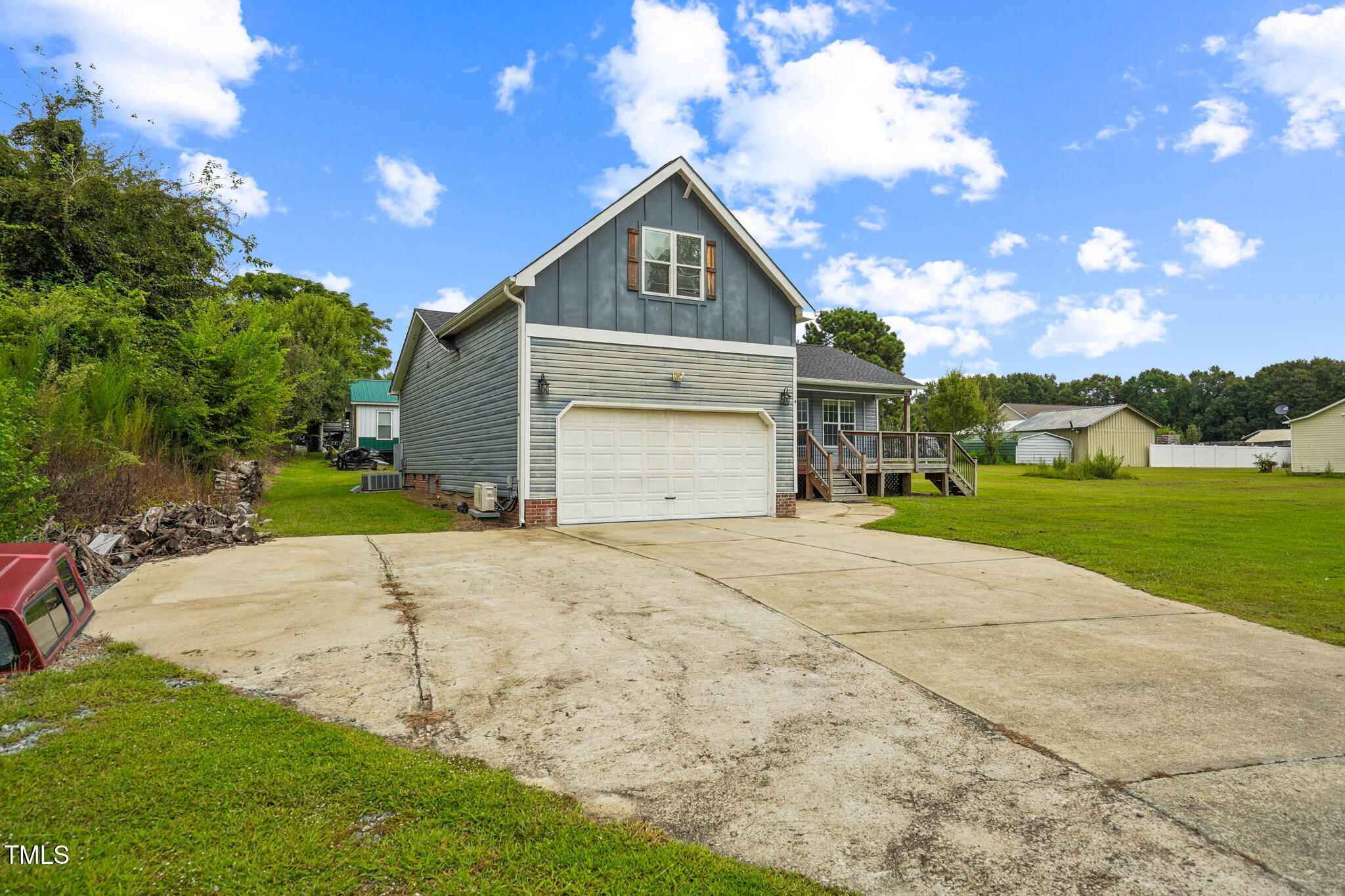 1270 Old School Road Four Oaks, NC 27524 - Photo 4 of 30 a front view of a house with a yard and garage