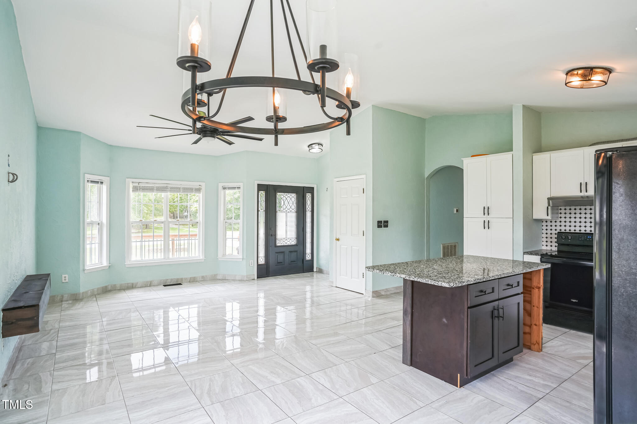 1270 Old School Road Four Oaks, NC 27524 - Photo 6 of 30 a kitchen with stainless steel appliances granite countertop a stove a sink and a refrigerator