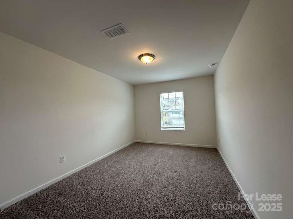 3514 Nimbell Road Monroe, NC 28110 - Photo 11 of 19 an empty room with a window