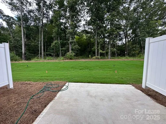 a view of a backyard with a garden