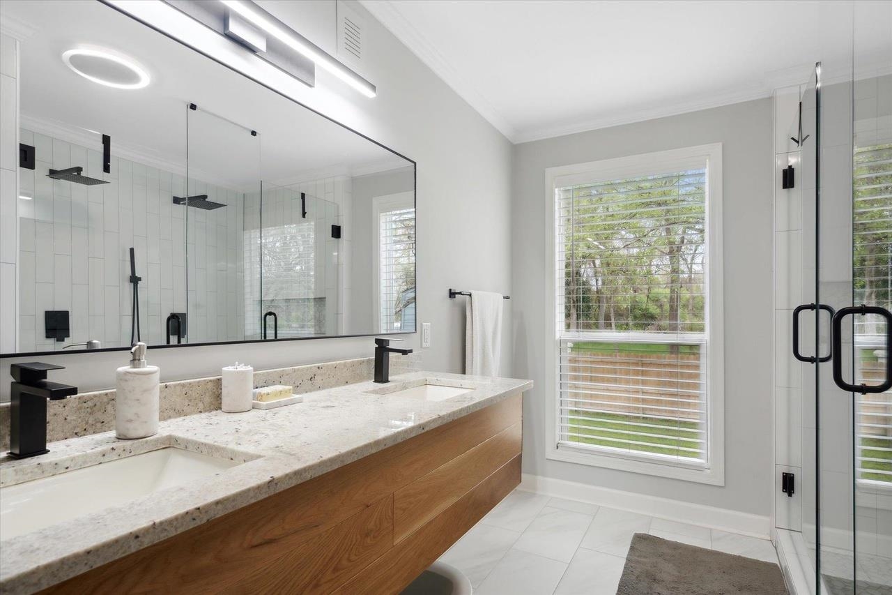 7250 Cedar Road Bartlett, TN 38135 - Photo 27 of 34 a spacious bathroom with a granite countertop sink and a mirror