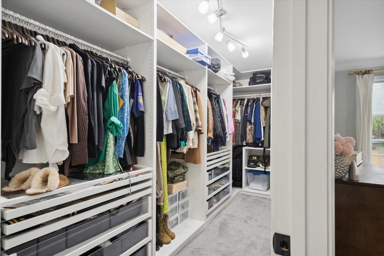 7250 Cedar Road Bartlett, TN 38135 - Photo 28 of 34 a view of walk in closet with clothes and shoes