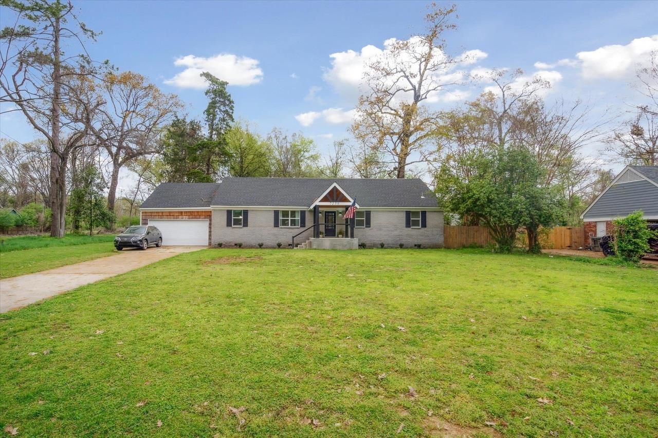 7250 Cedar Road Bartlett, TN 38135 - Photo 30 of 34 a front view of a house with yard and tree