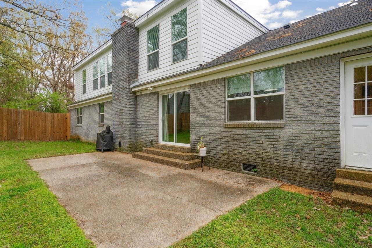 7250 Cedar Road Bartlett, TN 38135 - Photo 31 of 34 a view of a brick house with a yard
