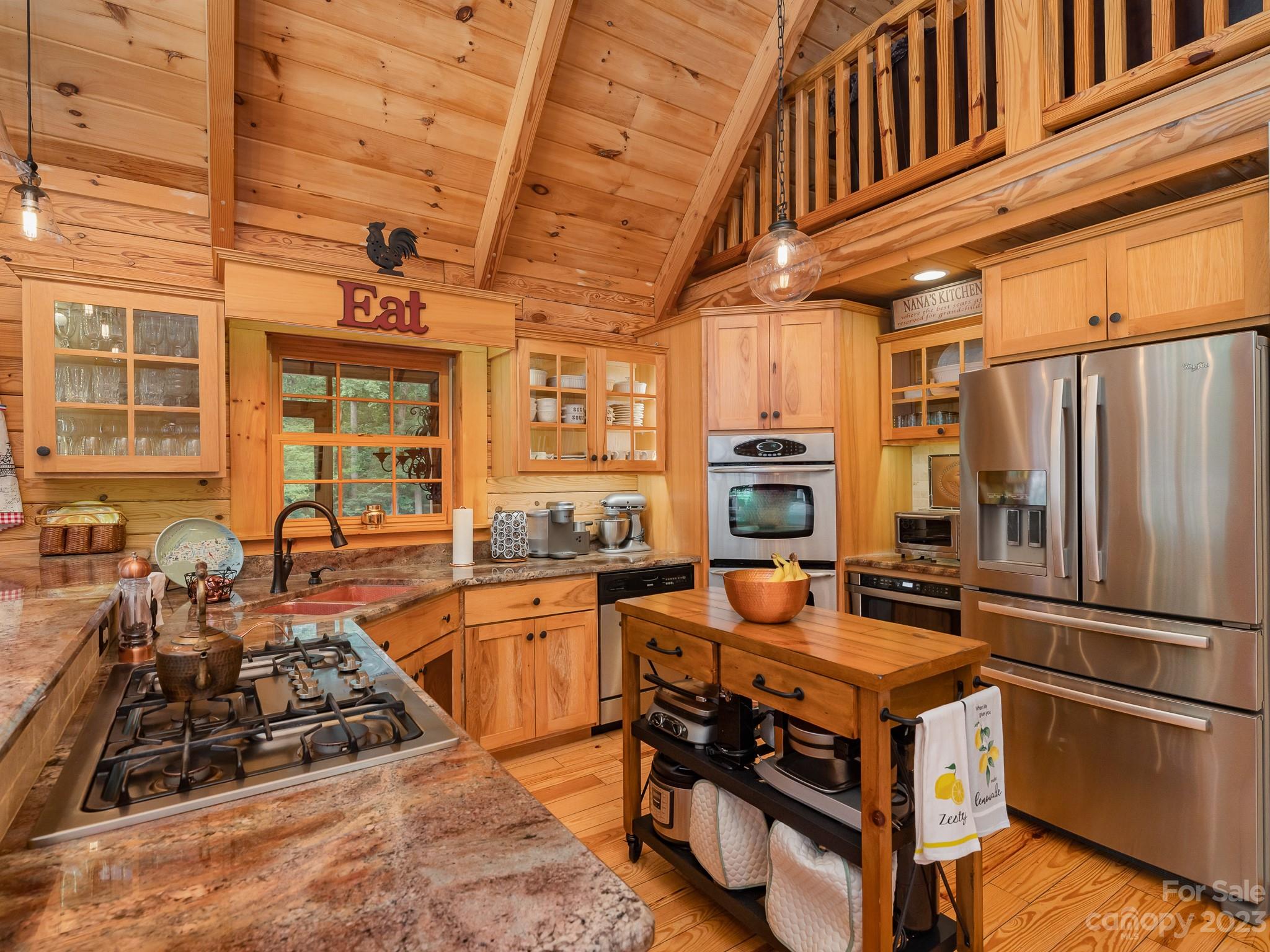 528 Manchester Road Mount Gilead, NC 27306 - Photo 12 of 34 a kitchen with stainless steel appliances a stove a sink and a refrigerator
