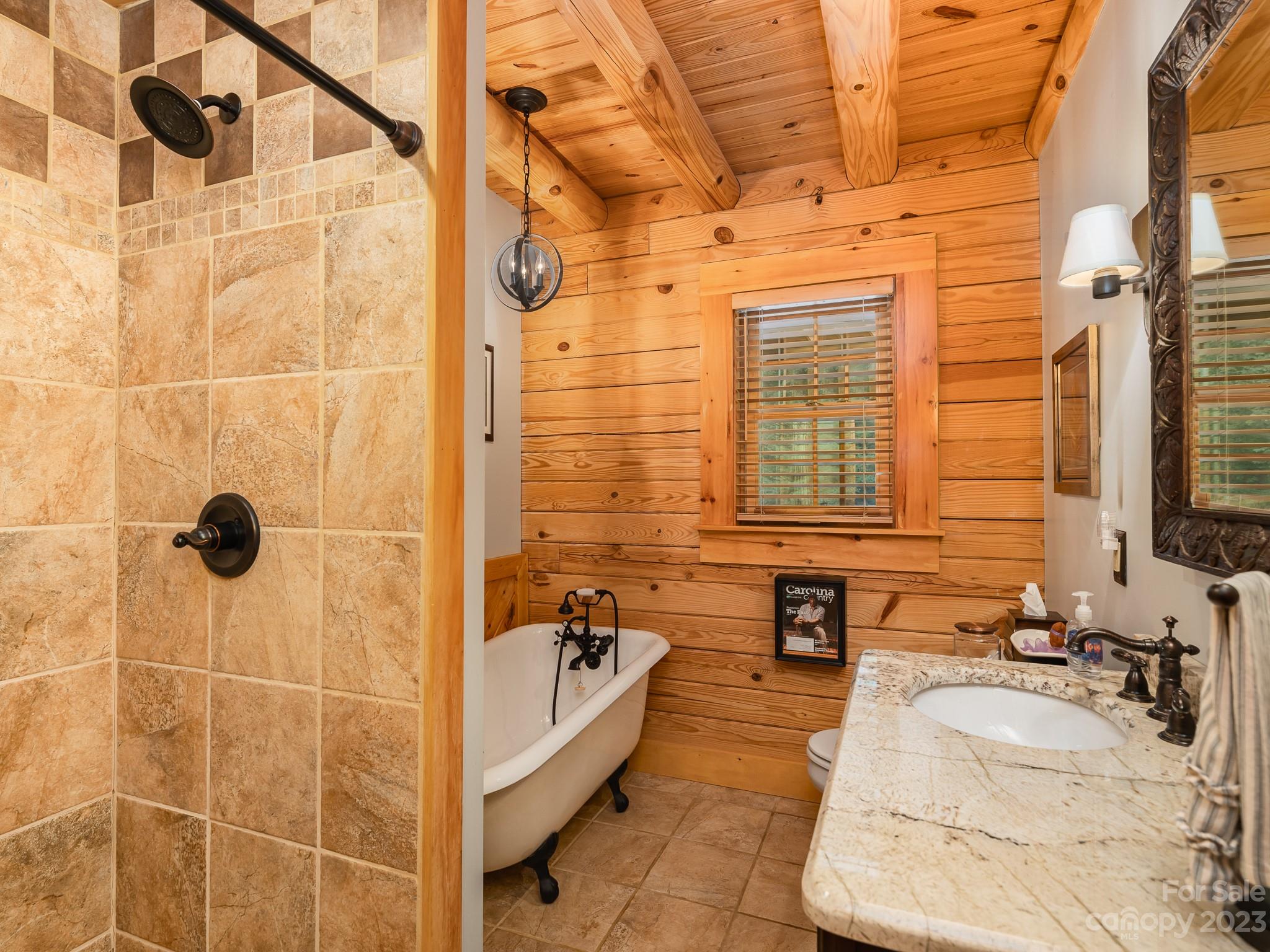 528 Manchester Road Mount Gilead, NC 27306 - Photo 15 of 34 a bathroom with a tub sink and shower