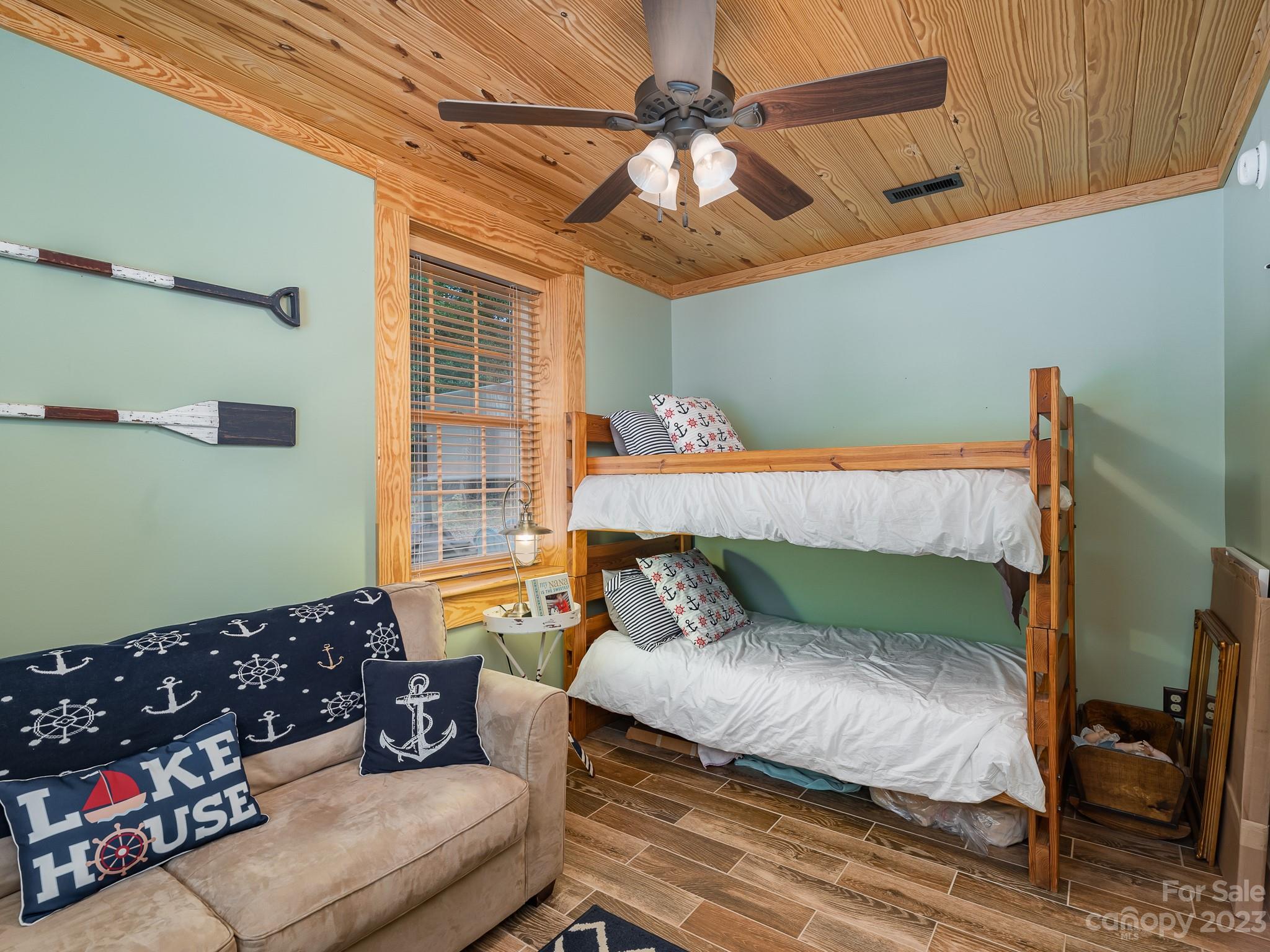 528 Manchester Road Mount Gilead, NC 27306 - Photo 23 of 34 a bedroom with a bed couch and window