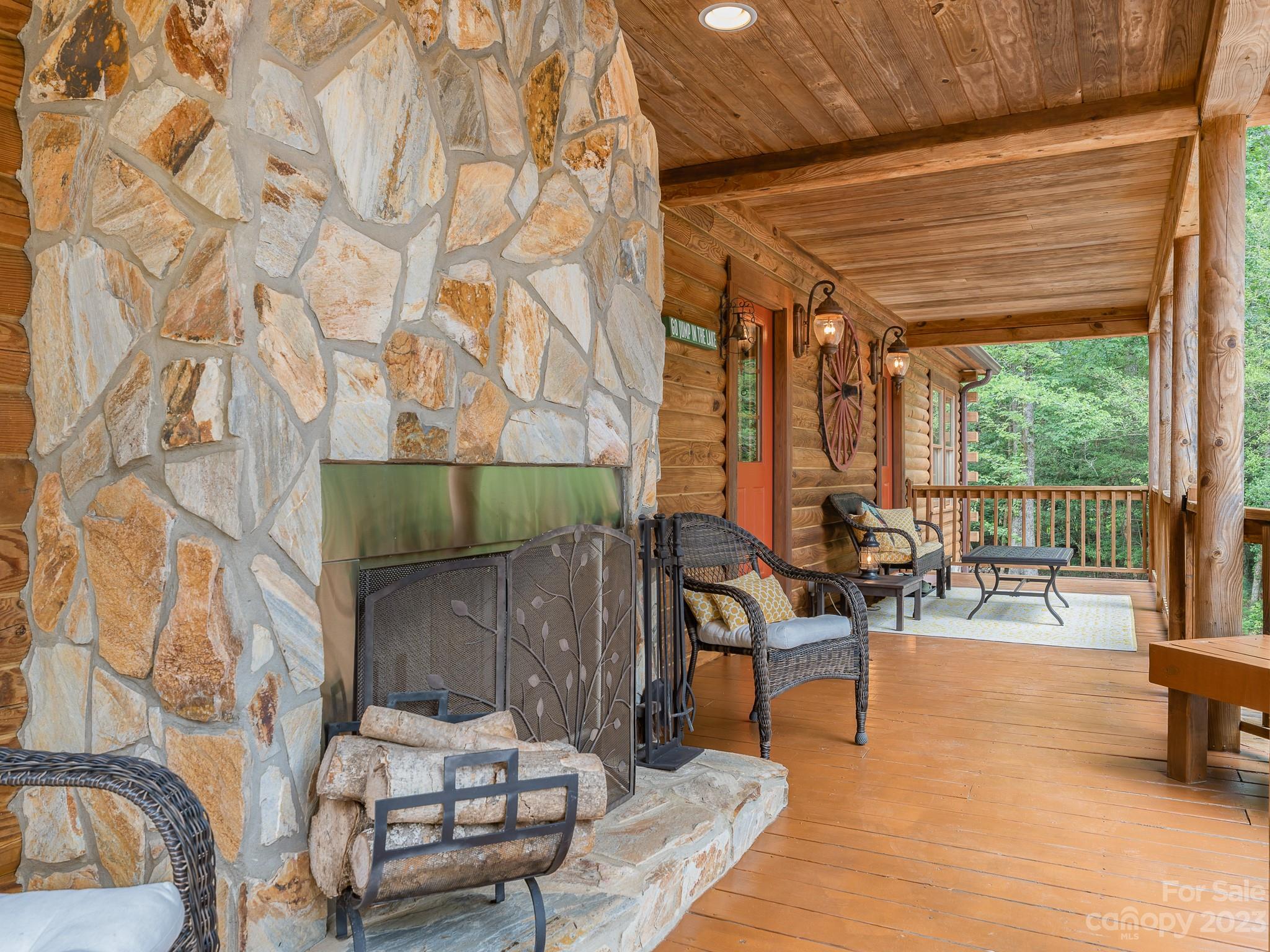 528 Manchester Road Mount Gilead, NC 27306 - Photo 28 of 34 a living room with furniture and a floor to ceiling window