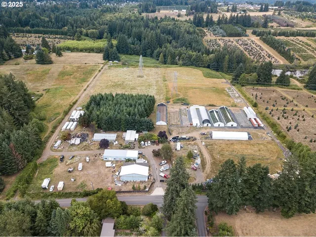 an aerial view of a house with a swimming pool