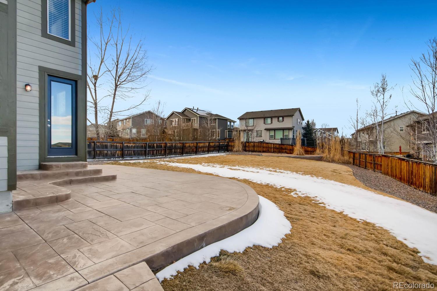 10951 Bluegate Way Highlands Ranch, CO 80130 - Photo 25 of 27 a view of a house with a yard