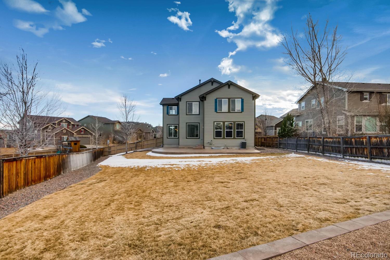 10951 Bluegate Way Highlands Ranch, CO 80130 - Photo 27 of 27 a view of a house with snow on the roof deck