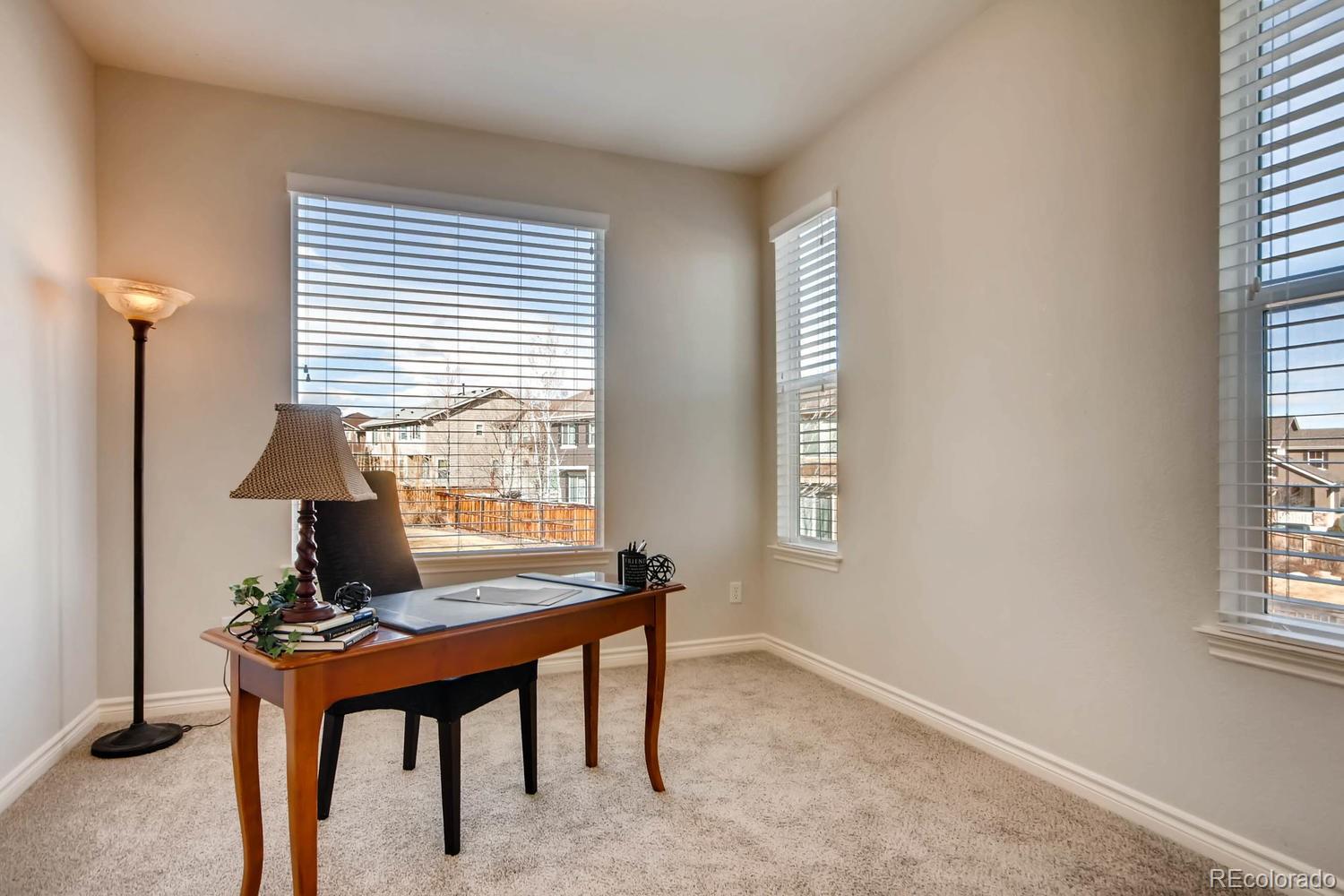 10951 Bluegate Way Highlands Ranch, CO 80130 - Photo 6 of 27 a workspace with furniture and a window